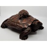 A 20th cent   oriental  carved wooden tortoise box