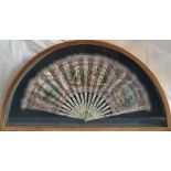 A 19th century French fan, the printed leaf with three hand coloured vignettes of figures within a