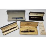 Two Sheaffer's "Snorkel" pens, both burgundy with Sheaffer 14ct. gold nibs in boxes, together with a