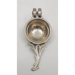 An Edwardian novelty silver tea strainer, by Levi & Salaman, assayed Birmingham 1907, having a