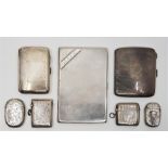 A collection of silver cigarette and vesta cases: to include; an engine turned silver cigarette