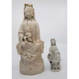 A 19th century Chinese Blanc de chine Guanyin, together with a similar smaller model. (2)