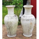 A large pair of weathered garden urns, (as found). (2)