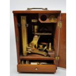 A 19th century brass microscope, in case.