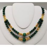 A precious yellow metal and malachite bead choker necklace, with silver gilt clasp, (yellow metal
