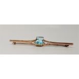 A 9ct. gold and light blue stone bar brooch, set large mixed rectangular cut light blue stone,