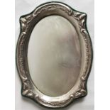 An Edwardian Art Nouveau oval silver photograph frame, by A C Jackson & Co, assayed Birmingham 1907,