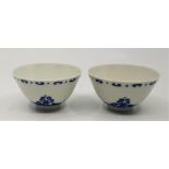 A pair of Chinese blue and white tea bowls, both bearing six character Yongzheng marks within double