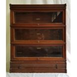 A Globe-Wernicke Co. Ltd. oak bookcase, comprising three glazed book sections, drawer base and