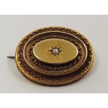 A Victorian precious yellow metal and diamond oval mourning brooch, set single old cut diamond to