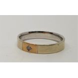 A 9ct, two-tone gold and diamond set band, white gold with yellow gold panel illusion set single