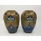 A pair of Royal Doulton vases, impressed marks and incised "LP", height 17.5cm. (2)