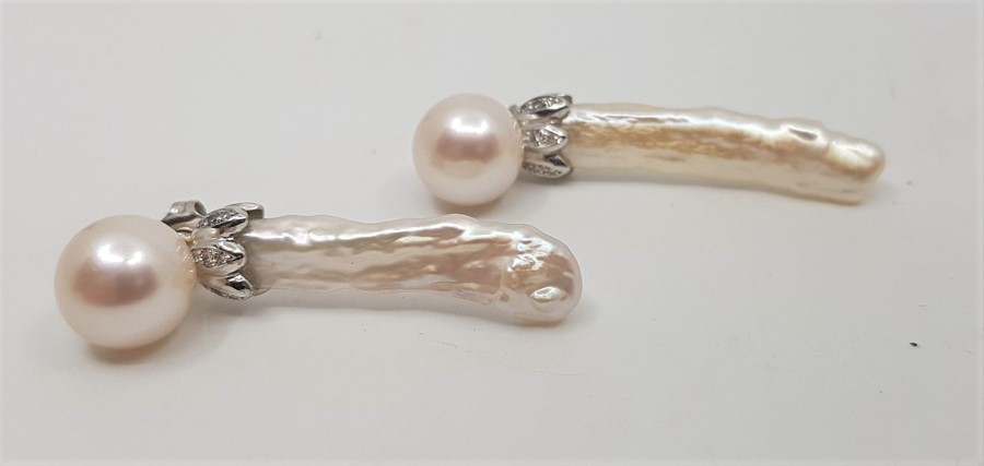 A pair of 18ct. yellow gold, platinum, diamond, cultured and baroque pearl earrings, each having