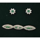 A pair of 18ct. white gold, diamond and emerald flower form cluster earrings, screw back fitting, (