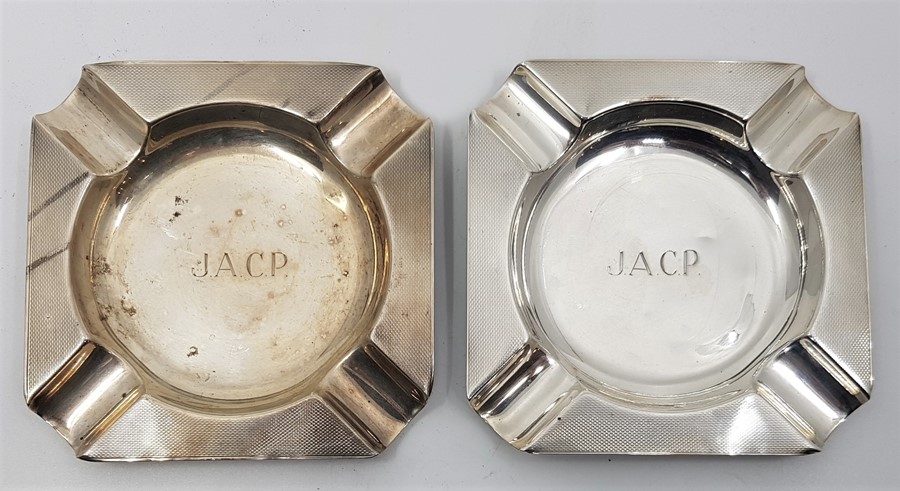 A pair of engine turned square silver ashtrays, by Boodle & Dunthorne, assayed Birmingham 1956-7, (