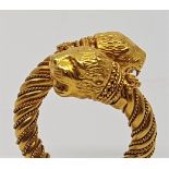 An Ilias Lalaounis Hellenistic gold cross-over ring, with double lion head terminals, (unmarked gold