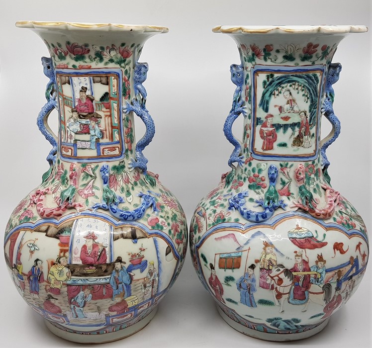 A pair of Qing dynasty Chinese vases, decorated in famille rose design of typical form, height 35cm