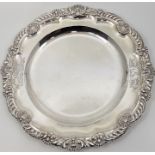 A Victorian silver circular plate, by William Ker Reid, assayed London 1855, having shell and scroll