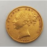 An 1856 Victoria "young head" gold sovereign.
