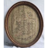 A George III textile sampler, a map of England and Wales, showing the counties, floral border,