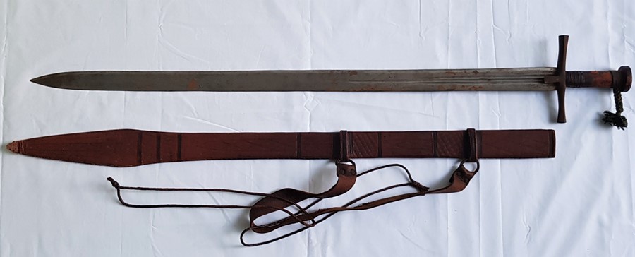 A Sudanese Kaskara sword, having flaring quillons and short langets, 88.8cm double edged blade