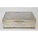 A silver rectangular cigarette box, by Joseph Gloster Ltd, assayed Birminghamn 1961, having engine
