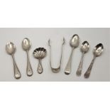 A Victorian silver caddy spoon, having shell shaped bowl and bright cut decoration, together with