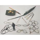 A collection of late 18th and 19th spectacles and lunnettes, to include: a pair of silver spectacles
