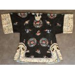 A Chinese Qing dynasty black silk robe, with typical embroidered detail