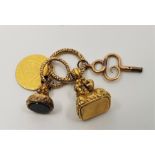 A 19th century yellow metal seal fob, together with a 1797 George III gold spade Guinea coin, a gilt