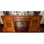 A Victorian burr walnut sideboard of large proportions, circa 1880, arched mirror back, fluted