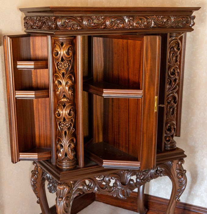 A mahogany drinks cabinet on stand, elaborately carved scrollwork throughout, retractable door - Image 2 of 2