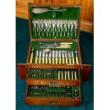 A late Victorian oak canteen of plated flatware, two frieze drawers, maker George Ibberson, width