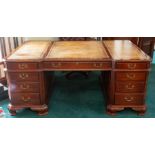 A mahogany partners pedestal desk of Chippendale design, inset tooled leather top, blind fret carved