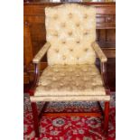 An armchair of Georgian design, yellow damask button upholstered Note: located at the vendor's