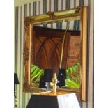 A recent gilt wall mirror with openwork scroll frame, 100 by 125cm Note: located at the vendor's