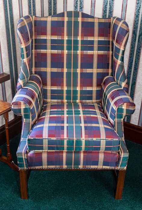 A wing back armchair of Georgian design, tartan upholstered Note: located at the vendor's property