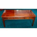 A mahogany coffee table of Georgian design, six frieze drawers, width 122cm Note: located at the