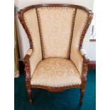 A recent wing back armchair with damask upholstery, carved frame Note: located at the vendor's