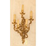 A pair of cast metal five light wall lights of Rococo design, height 70cm (2) Note: located at the