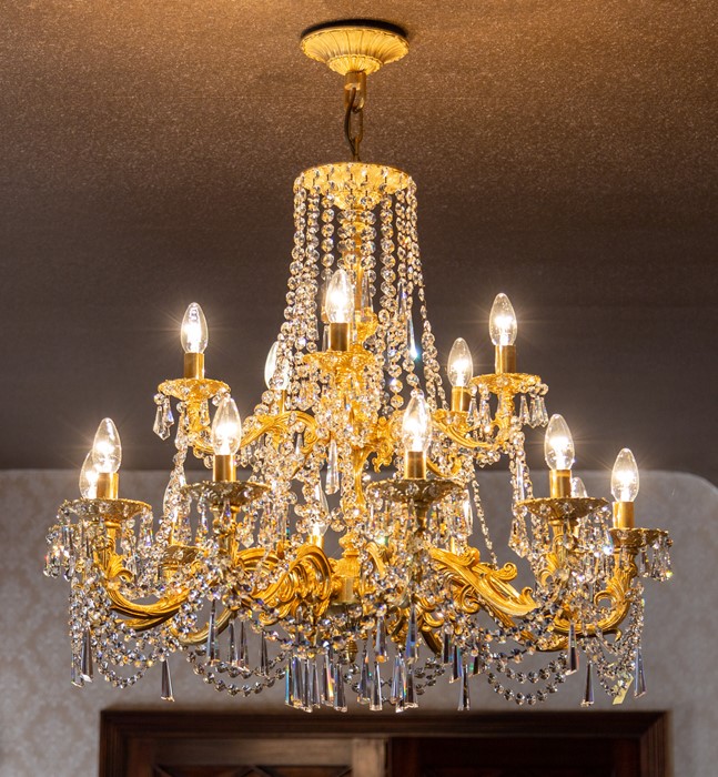 A gilt metal fifteen light pendant electrolier with cut glass droppers, drop approximately 95cm
