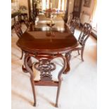 A mahogany D-end extending dining table of Victorian design, four leaves, gadroon carved bulbous