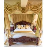 A pair of mahogany double bed frames, elaborately carved with scrollwork devices (2) Note: located