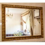 A large gilt framed wall mirror, 110cm by 140cm Note: located at the vendor's property in South