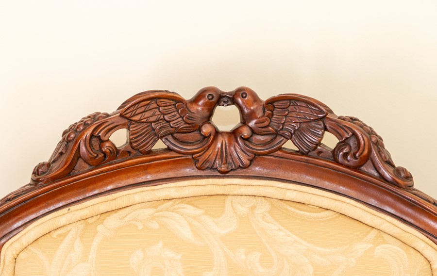 A pair of recent wing back armchairs, damask upholstery, carved lovebirds to the top rails (2) Note: - Image 4 of 4