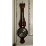 A 19th Century mahogany strung and inlaid wheel barometer, broken pediment, thermometer, silvered