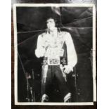 A 1977 autographed photograph depicting Elvis Presley and signed by the performer "Best Wishes,