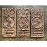 Three English school Elizabethan oak wall panels, circa 1560, portrait carving of Romanesque maids