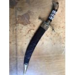 A Middle Eastern dagger, the hilt inset with mother of pearl, leather scabbard, length 33cm