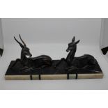 An Art Deco cast sculptural group of Antelopes on marble plinth